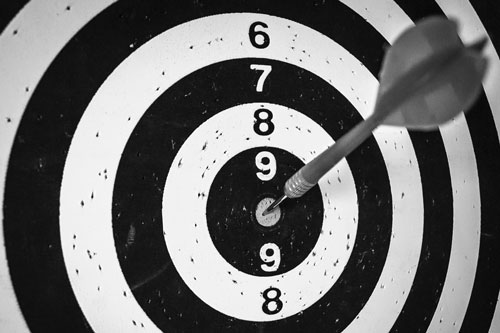A dart and a target indicating the right target to generate the right leads.